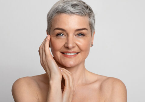 woman smiling after receiving uItherapy treatment.