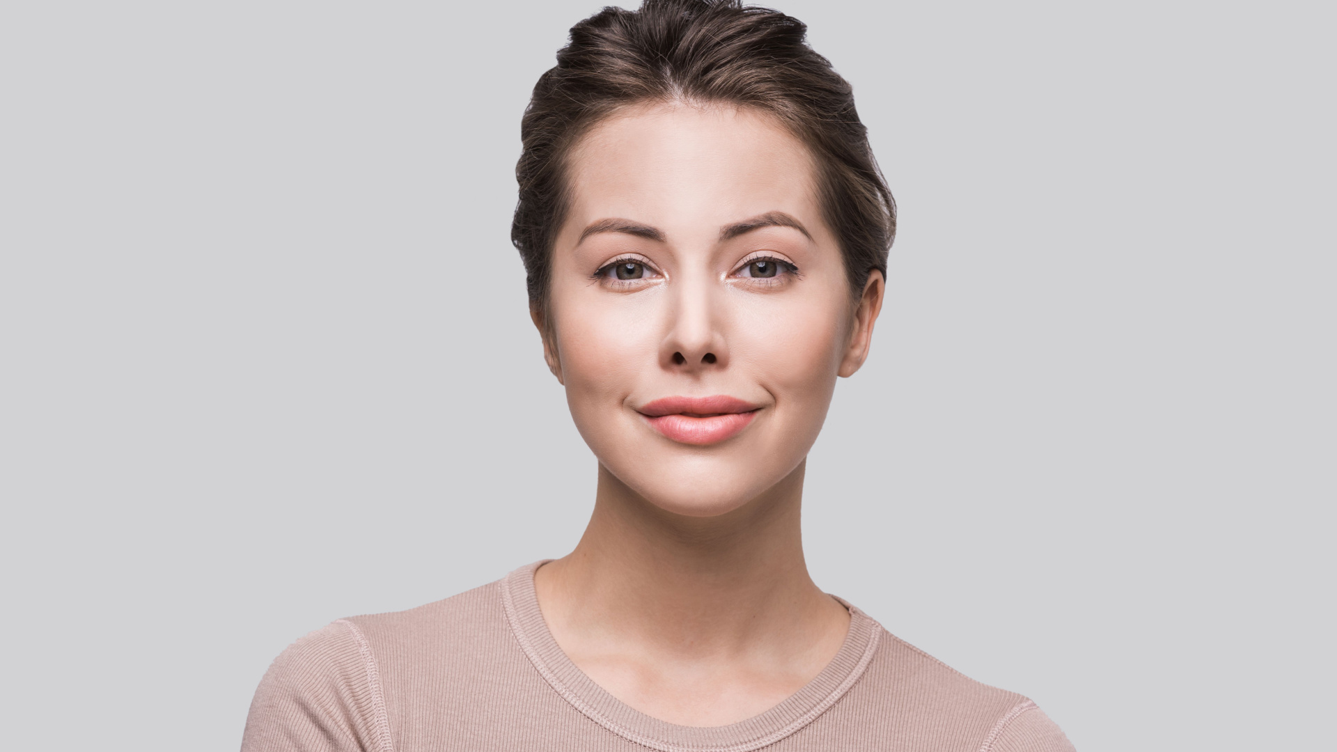 Beautiful woman smiling after getting Juvederm