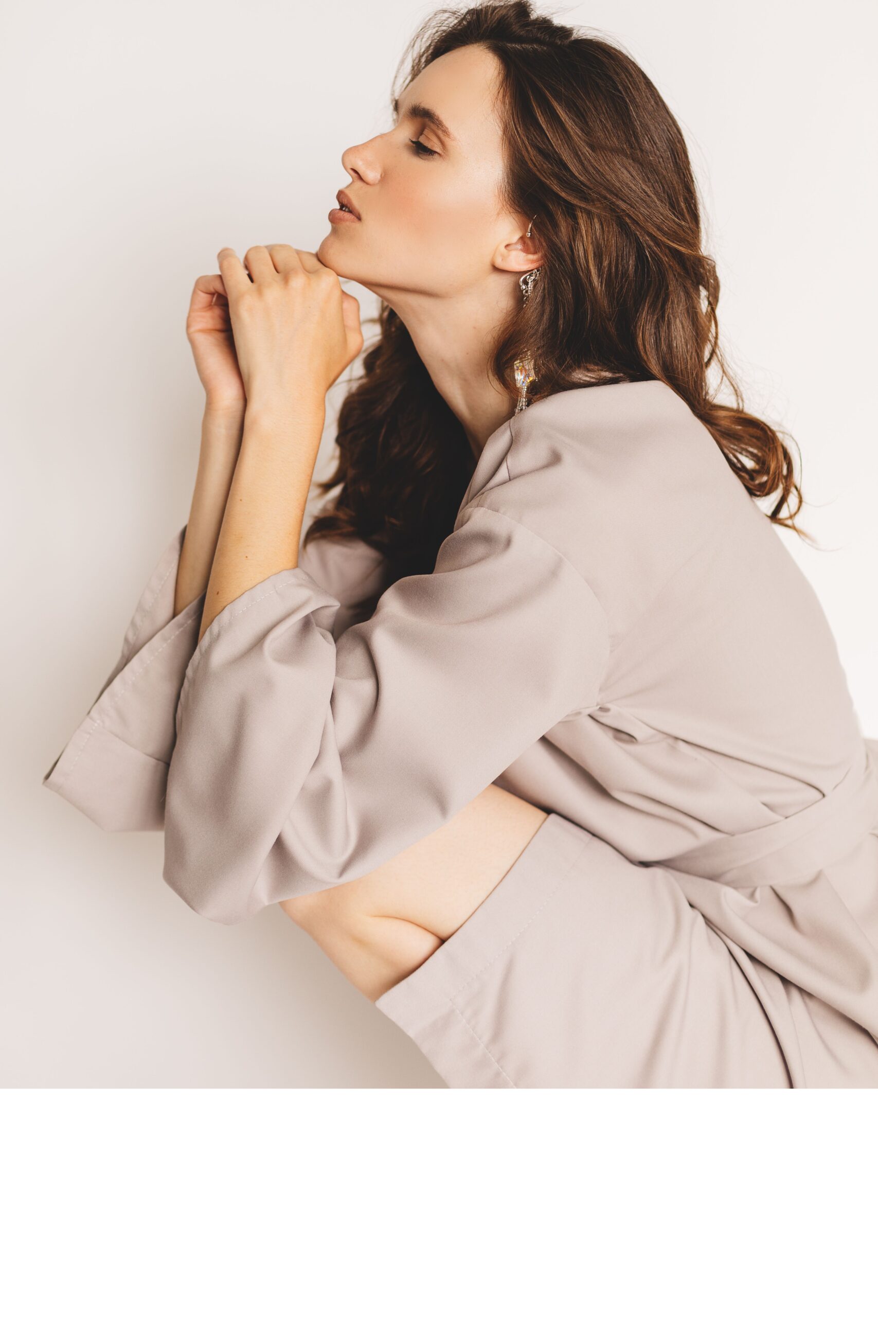 woman showing off her beautiful skin after moxi laser treatment