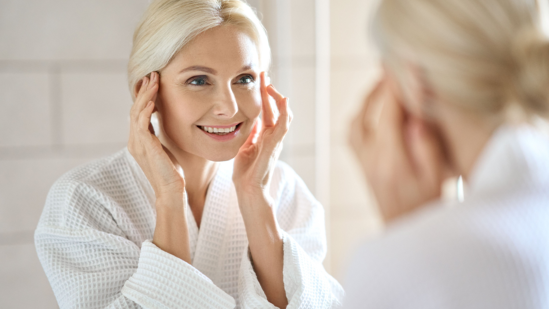 woman looking into a mirror