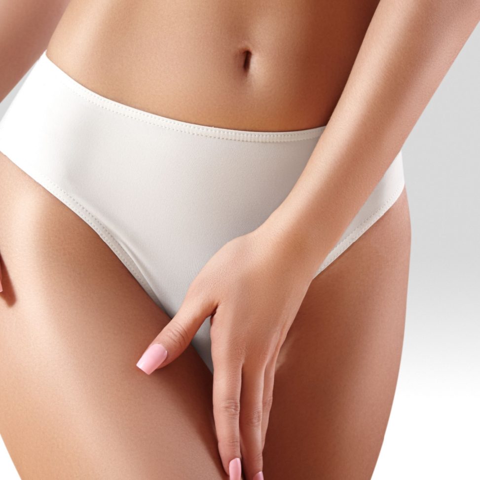 white women touching her thigh with white underwear