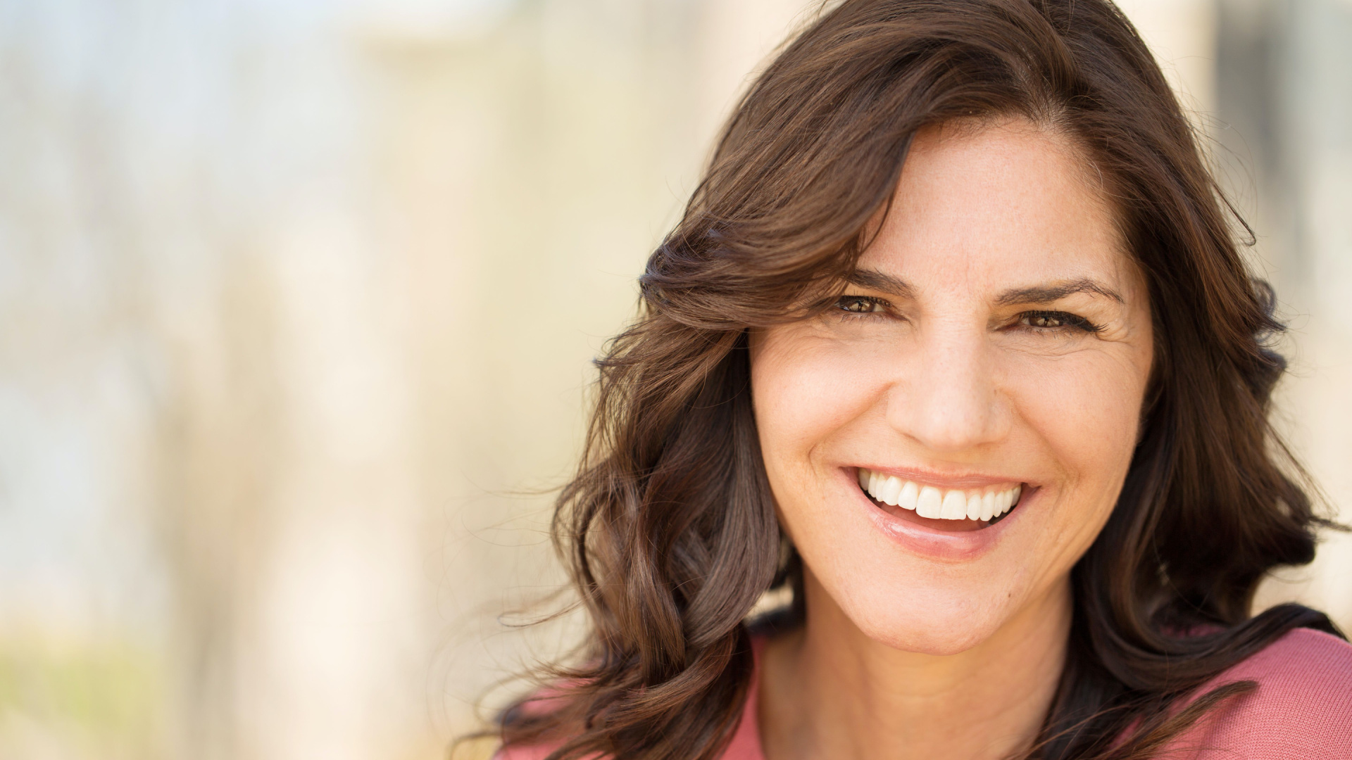older white women with brown hair with outside background