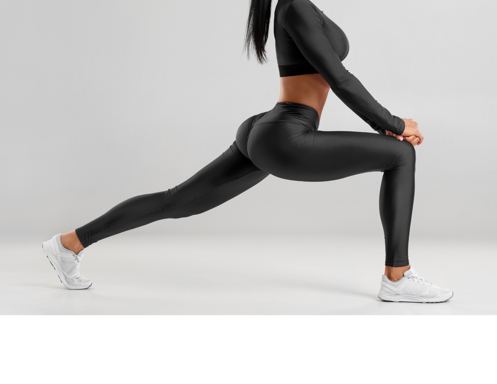 woman in leggings stretching