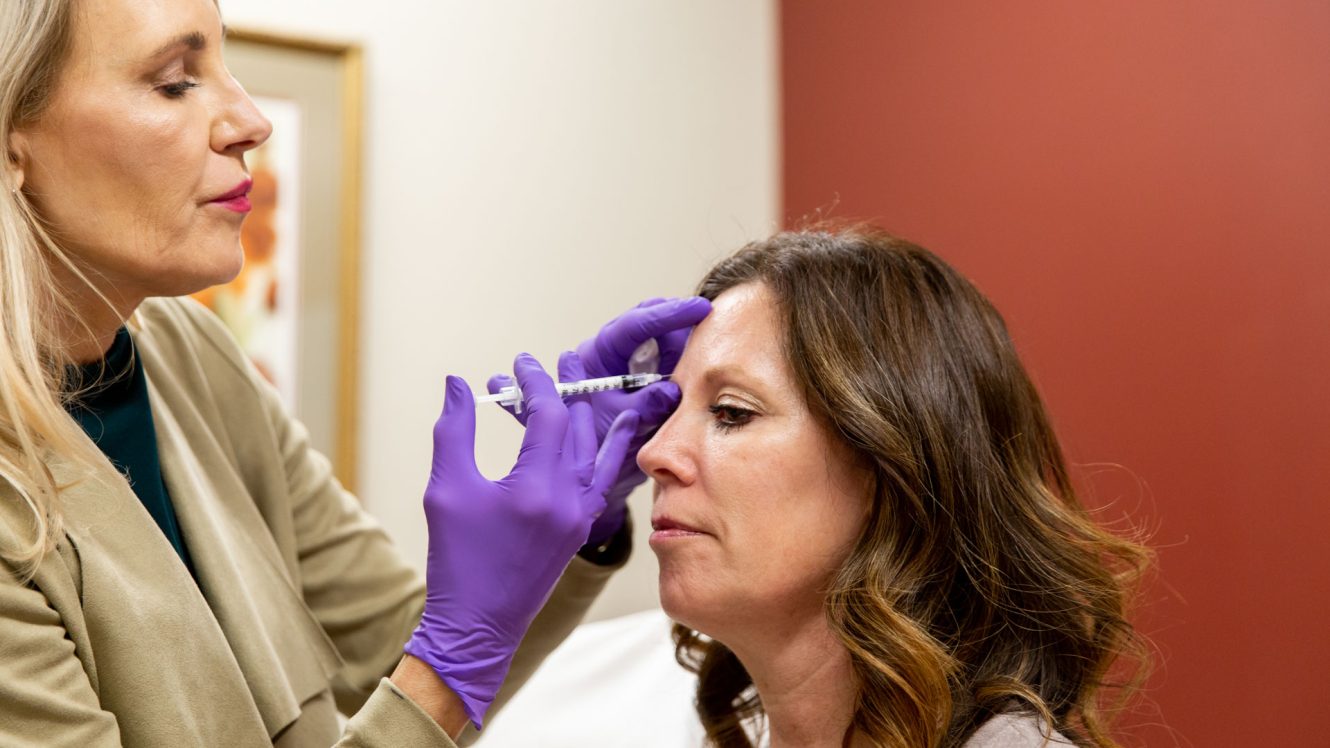 Woman Receiving Injection from doctor