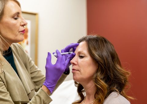 Woman Receiving Injection from doctor