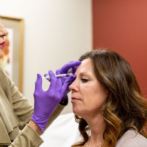 Woman Receiving Injection from doctor