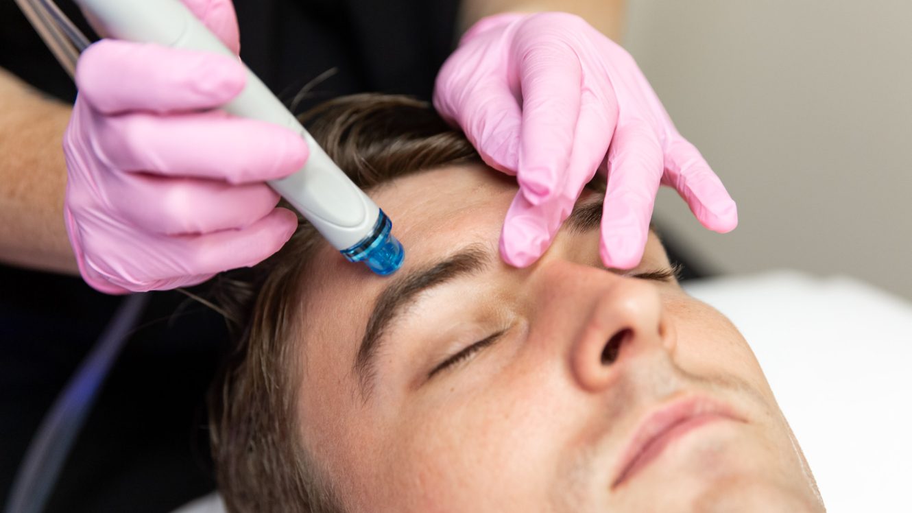 Man receiving Hydrafacial treatment