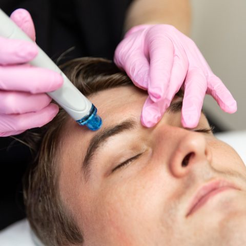 Man receiving Hydrafacial treatment