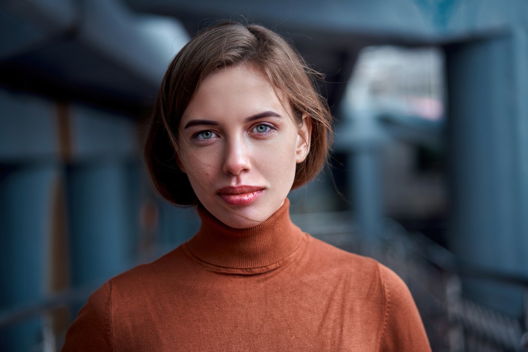 beautiful woman with short bob in light brown turtleneck