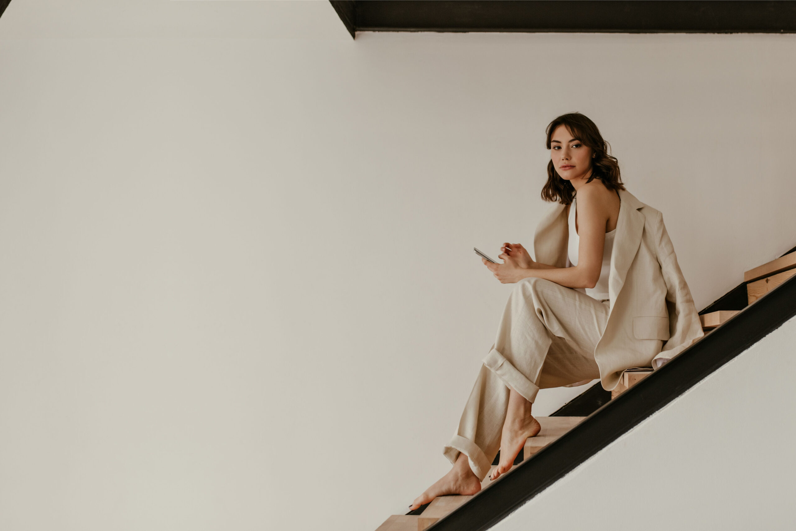 woman sitting on a staircase looking at the camera