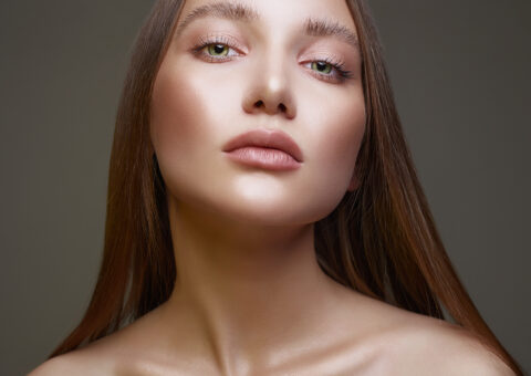 women wearing makeup looking at the camera after receiving a face lift.