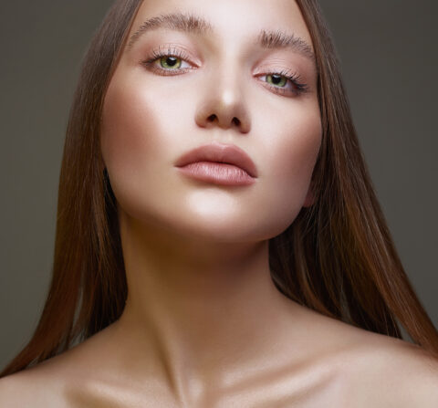 women wearing makeup looking at the camera after receiving a face lift.