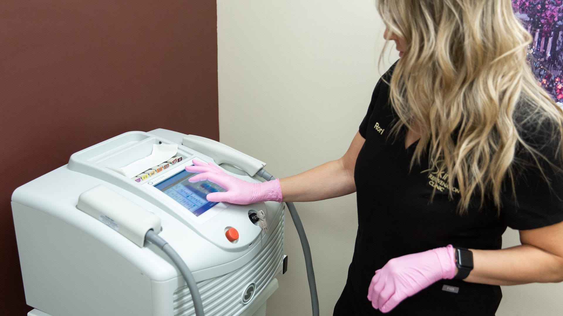 Woman using a laser hair removal machine