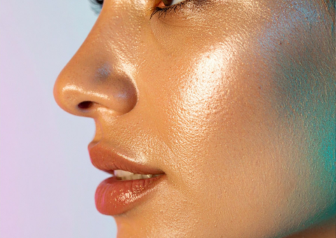 Close-up side profile of a woman with glowing, dewy skin, highlighting smooth texture, hydration, and refined skin tone for skin rejuvenation concept.