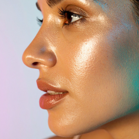 Close-up side profile of a woman with glowing, dewy skin, highlighting smooth texture, hydration, and refined skin tone for skin rejuvenation concept.